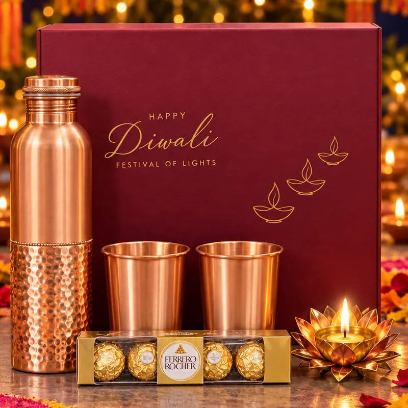 Tamra Classic Diwali hamper: maroon box with copper bottle, copper glasses, Ferrero Rocher and brass diya