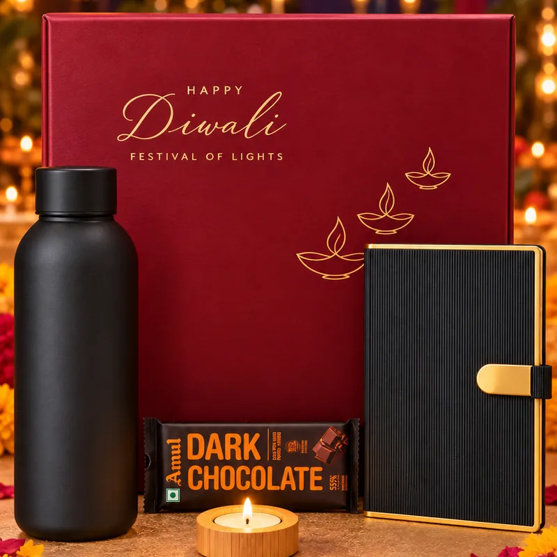 The Executive Diwali hamper: maroon box with black bottle, diary, dark chocolate and tealight