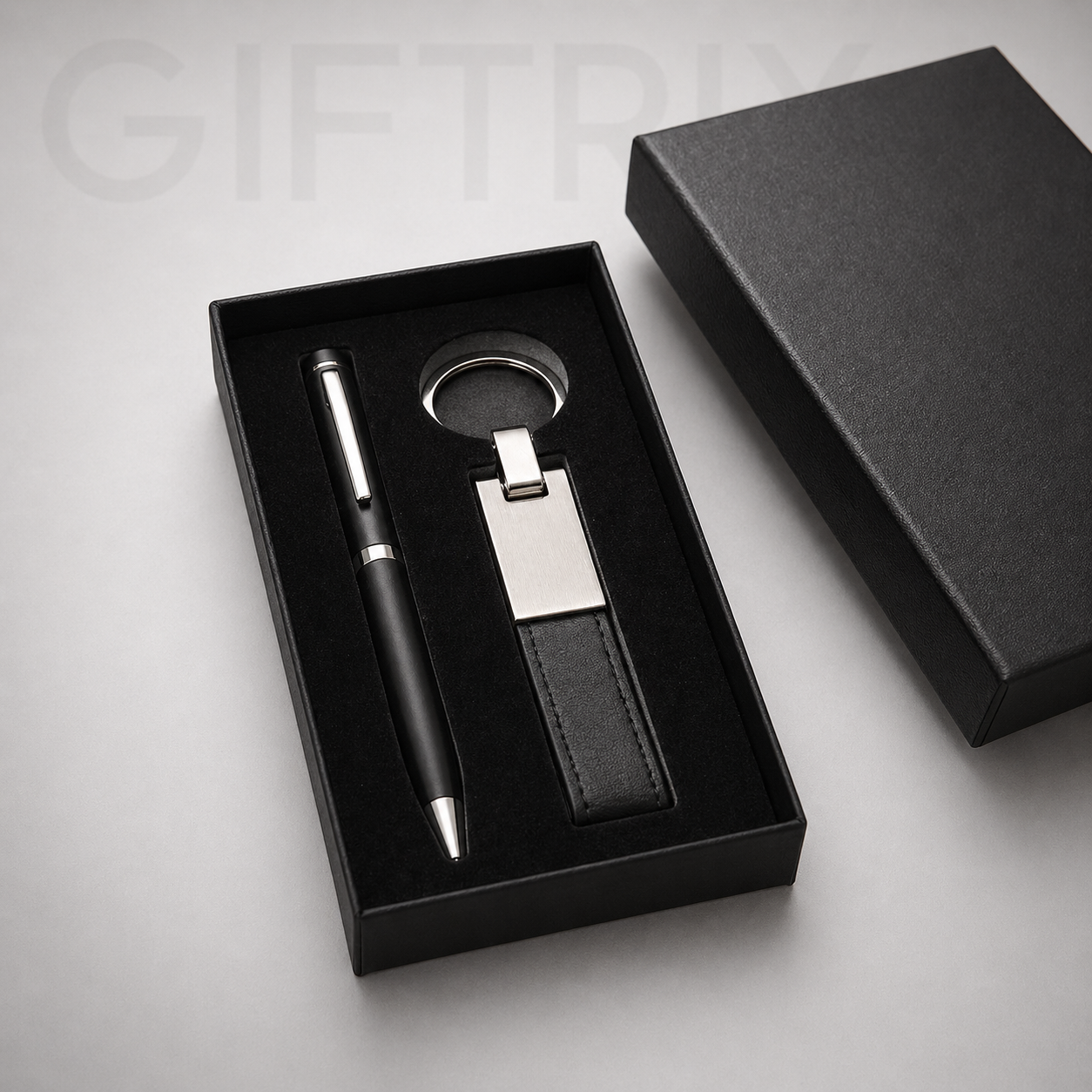 Black pen and keychain duo in gift box